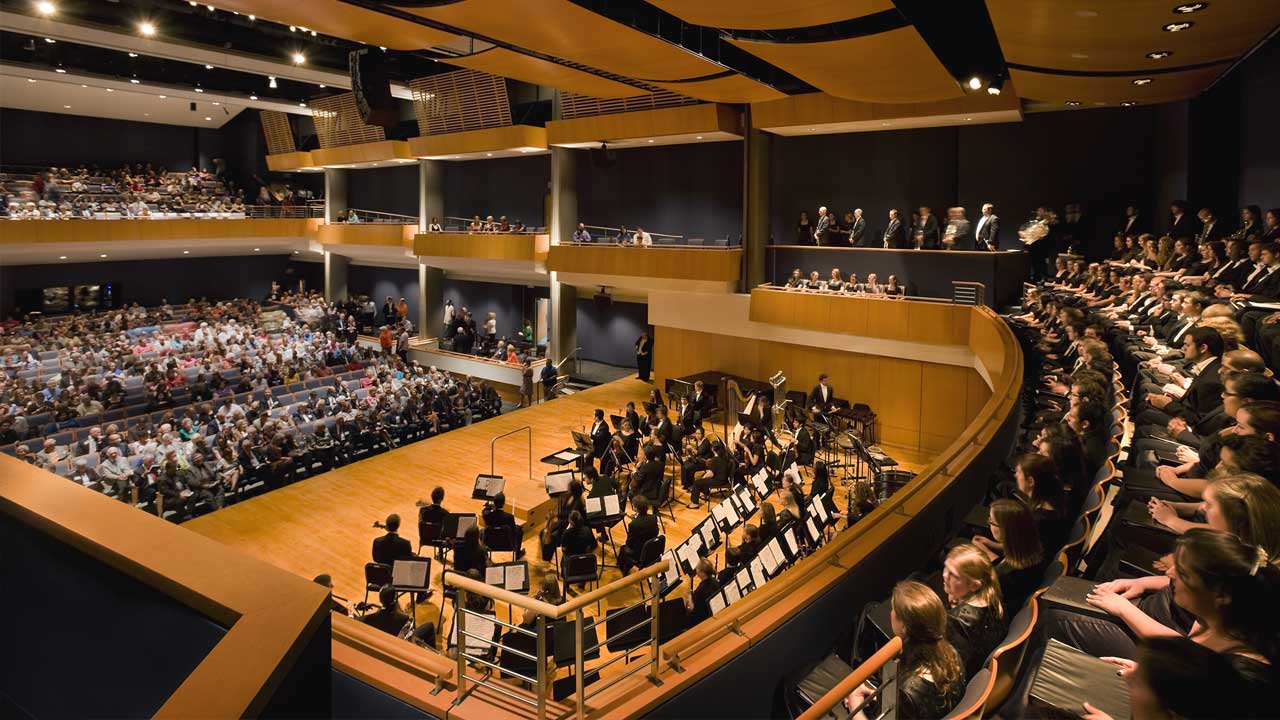 The SHSU concert hall with an orchestra in concert and attendees in the hall