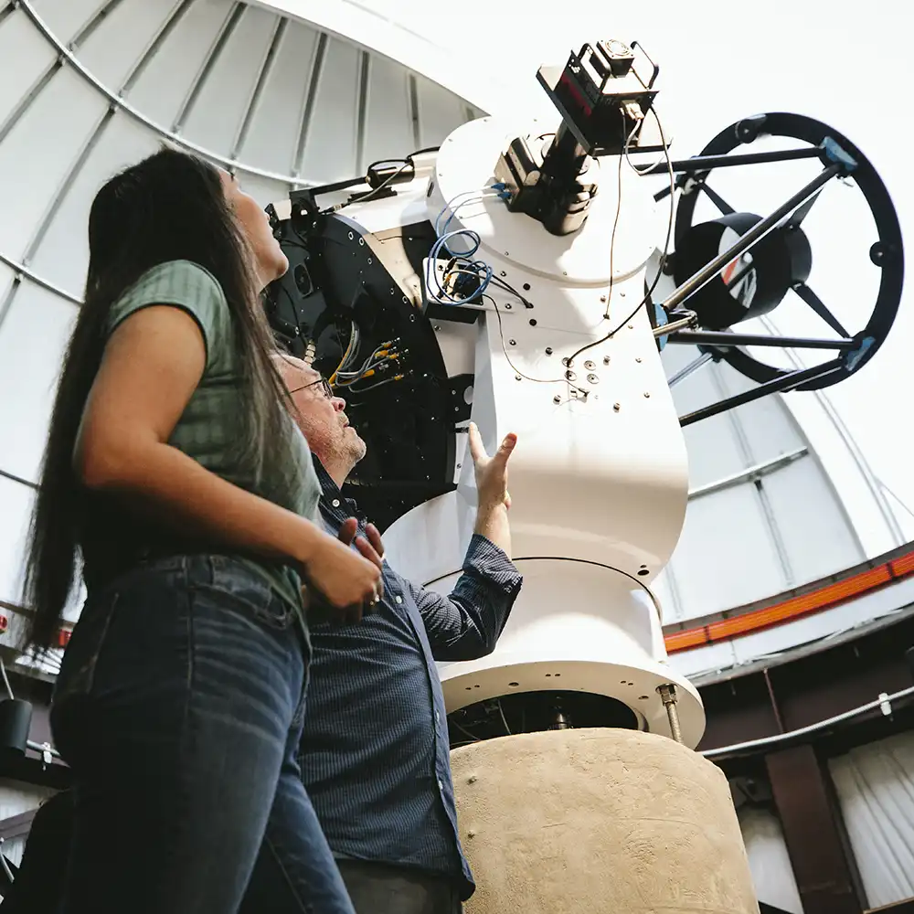 SHSU Students looking at the Dominey Observatory Telescope