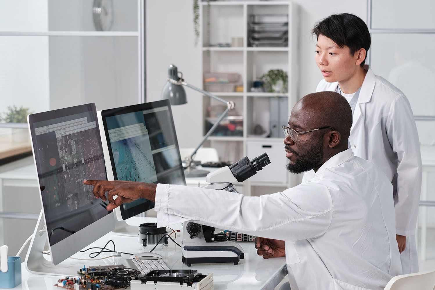 Scientist Pointing at Computer Screen