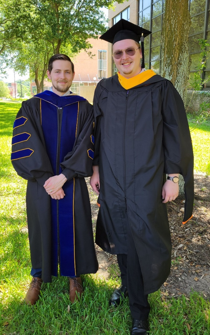 Jared Sharp and Dr. Davidson in graduation attire