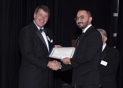 2018 Recipient, Luis Rodriguez (right), Senior Personal Banker, Amegy Bank, with Dr. Mitchell Muehsam, Dean of College of Business Administration