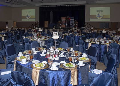 Wide shot of table 24 with the stage of the background