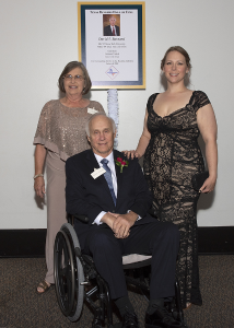 Barnard and others posing in front of award