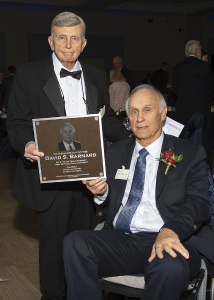 Barnard posing with plaque