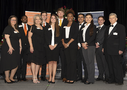 11 people on stage posing