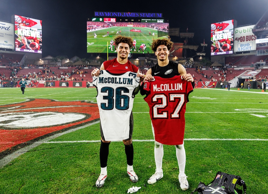 Zyon McCollum (left) and Tristin McCollum exchange jerseys after their Jan. 15 playoff matchup at Raymond James Stadium in Tampa. (Tampa Bay Buccaneers)