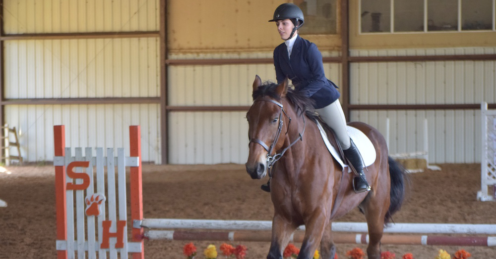 Kinsey Hebisen performs in the over-fences portion of the SHSU English Horse Show.