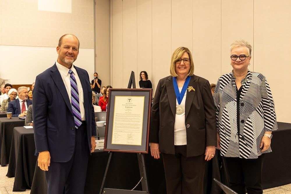 Pamela Zelbst pictured with Regent Stephen Lee and SHSU President Alissa White at the TSUS Board of Regents' monthly meeting Nov. 22. 