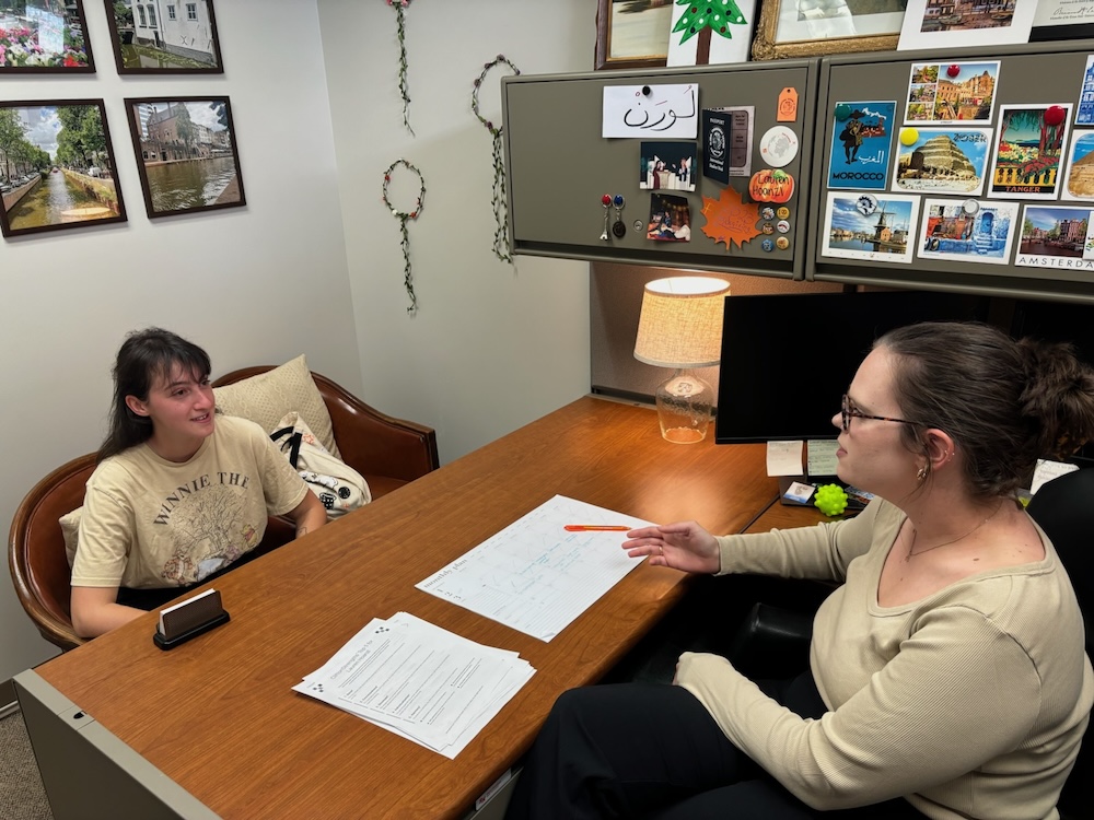 Sara Pacifici (left) meets with Undergraduate International Student Advisor Lauren Hoanzl in SHSU's Global Engagement Center (GEC).