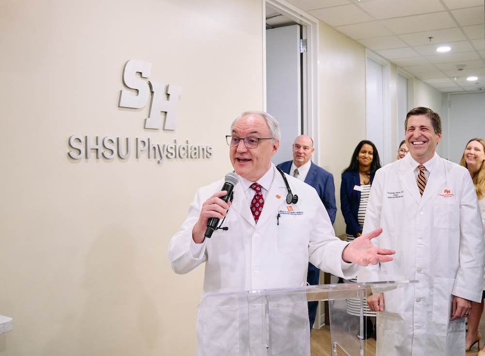 Dr. Craig Boudreaux (left) and Dr. Thomas J. Mohr, D.O. (right), address open house attendees.