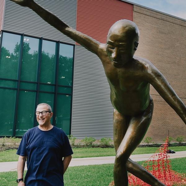 Artist Nic Nicosia next to his sculpture titled, "a big thank you."