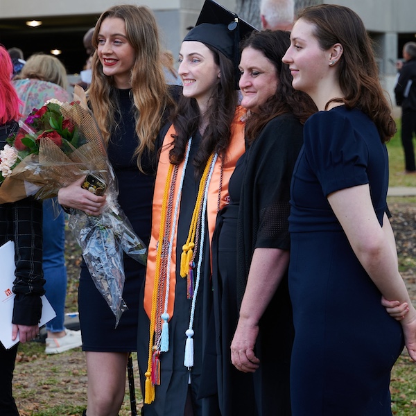 Rachel Stewart (center) poses with her family after commencement.