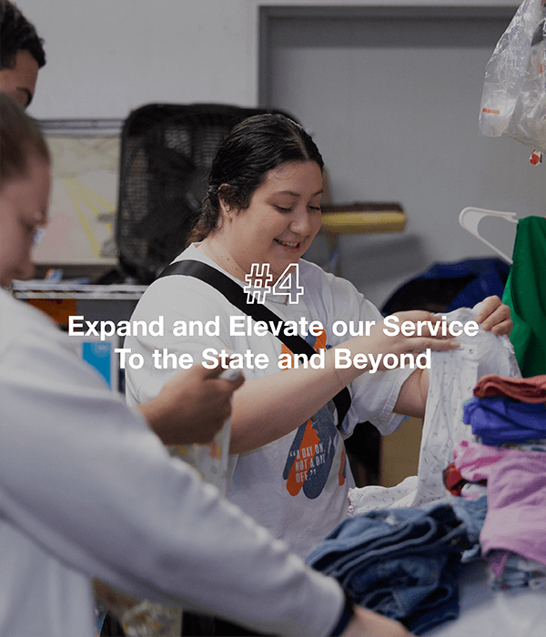 Women looking through a pile of clothes